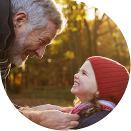 Grandfather smiling at grandaughter