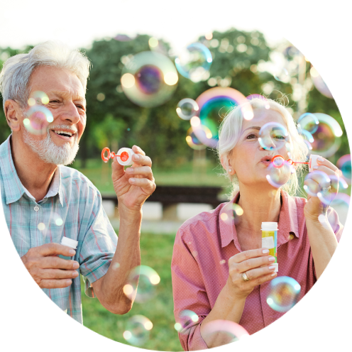 Man and woman blowing bubbles